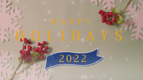 animation of snow falling and happy holidays 2022 text over christmas decorations