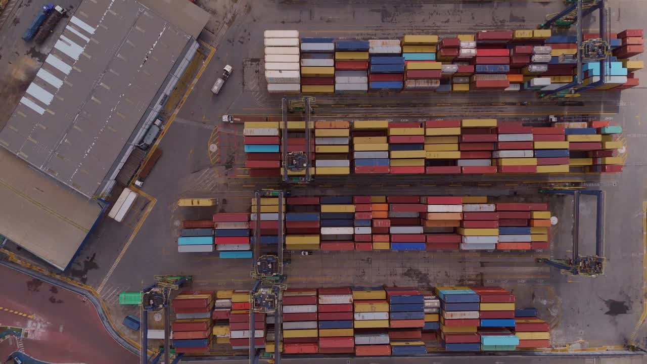 Industrial aerial perspective of a container terminal at the Port of Salvador, highlighting global trade and maritime logistics in Brazil