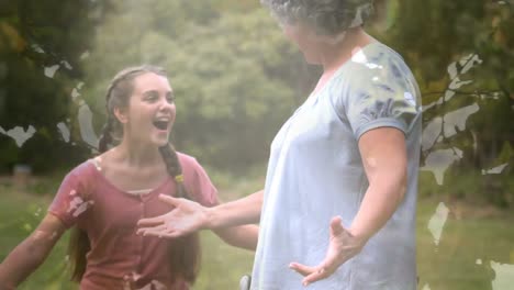 animation of tree over senior caucasian woman sitting in wheelchair and her granddaughter