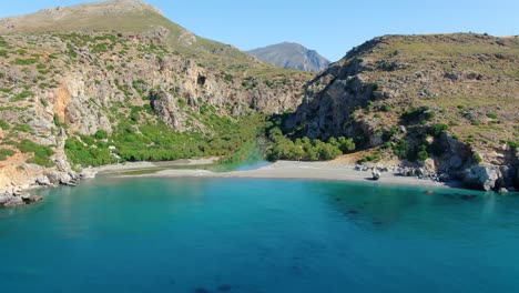 Aerial-view-of-Preveli-lagoon,-a-paradisiac-beach-on-the-south-coast-of-the-island-of-Crete