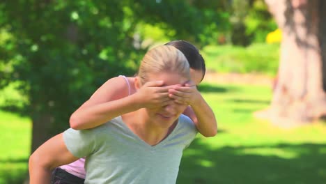 Young-girl-on-her-mothers-back