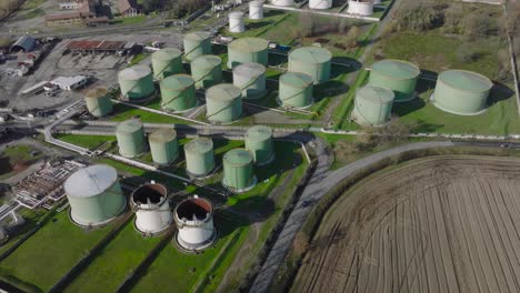 Aerial-view-of-steel-round-Oil-Storage-Tanks,-storage-and-handling-services-for-petroleum-products