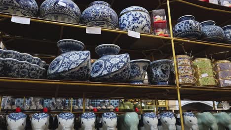 shelves filled with various ceramic items.