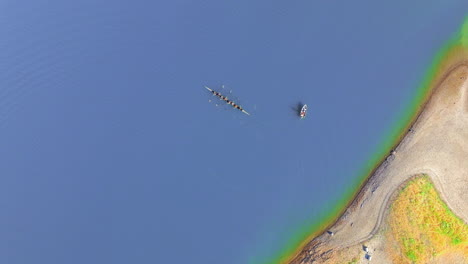 top view of athletes training rowing at lexington reservoir in california