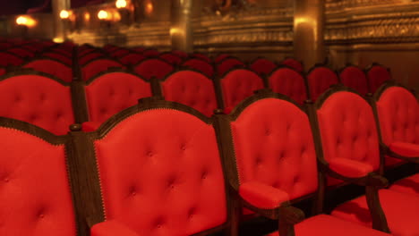 rows of red chairs in an opera house