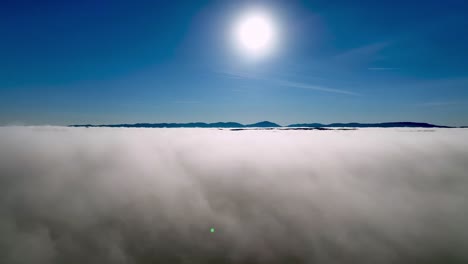 aerial side shot above the clouds in wilkes county nc, north carolina