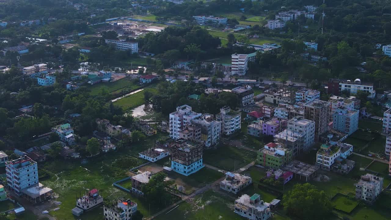 City with Apartment buildings and trees pass underneath in Sylhet, Bangladesh