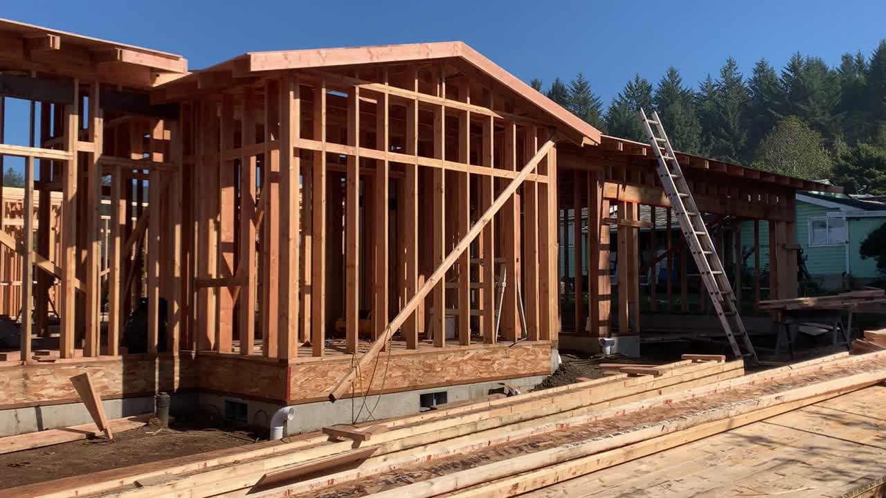 Wooden-frame House Under Construction On A Sunny Day