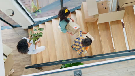 new home, box and parents and kids on stairs