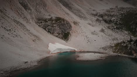 Scenic-view-of-glacier-melting-in-a-lake-at-the-Italian-Dolomites