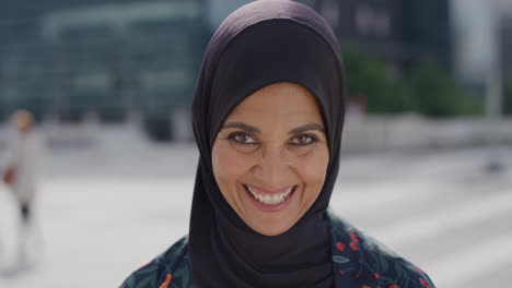 slow motion portrait middle aged muslim woman laughing happy enjoying successful urban lifestyle independent senior female wearing hijab headscarf in city