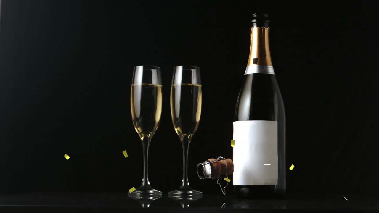 Animation af guld konfetti der falder over champagneglas og flaske på sort baggrund