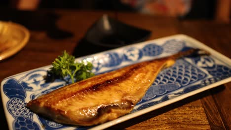 delicious grilled fish served on decorative plate