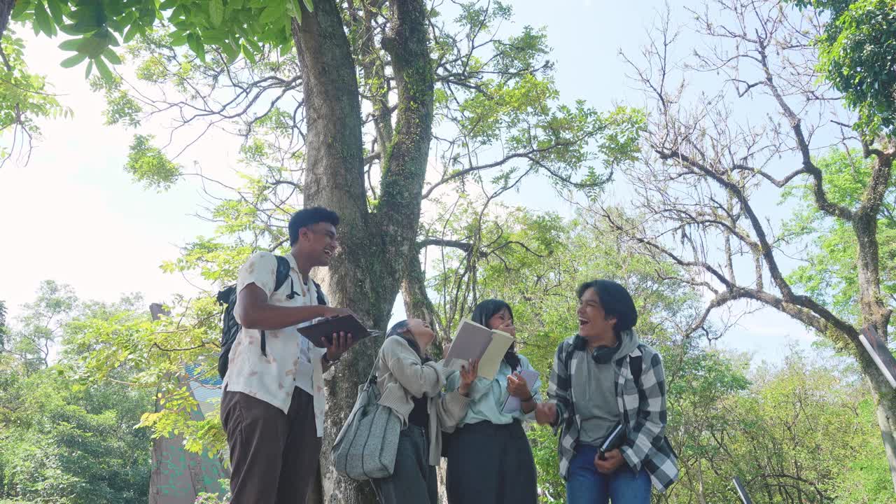 Happy Young Interracial College Students Chatting And Laughing With Each Other After Class Standing outside