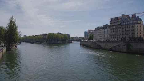 bridges crossing river seine in paris france with tourists 2