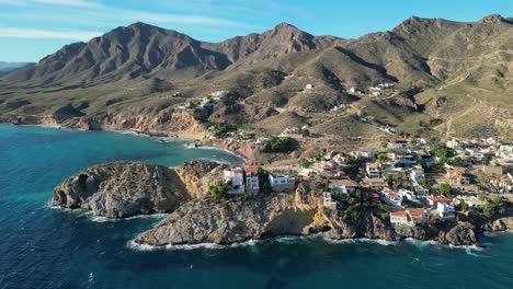 coast, mountains and cliffs at bolnuevo beach, murcia, spain - aerial 4k