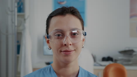 Portrait-of-assistant-with-protective-glasses-at-oral-care-clinic