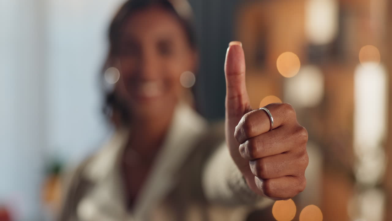 A woman giving a thumbs up gesture