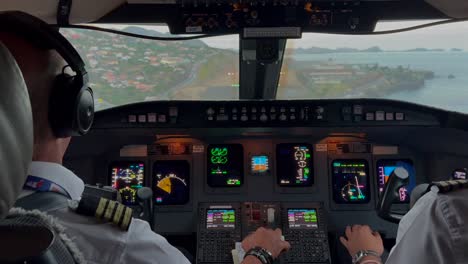 real time approach to madeira funchal airport. immersive view of the airport and runway recorded from inside the cockpit of a jet arriving at nightfall. 4k 60fps