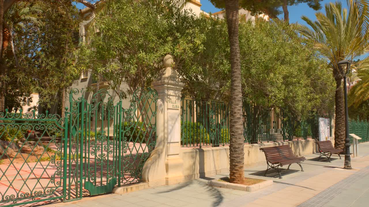 Villa Elisa Entrance With Steel Fence In Ruta de las Villas de Benicasim, Spain. Panning Left