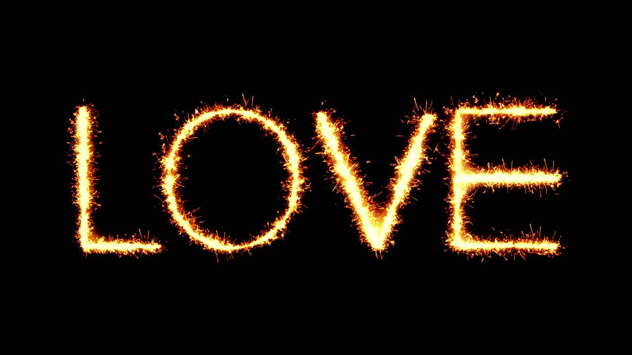 Love text sparkler writing with glitter sparks particles firework on black 4k loop background