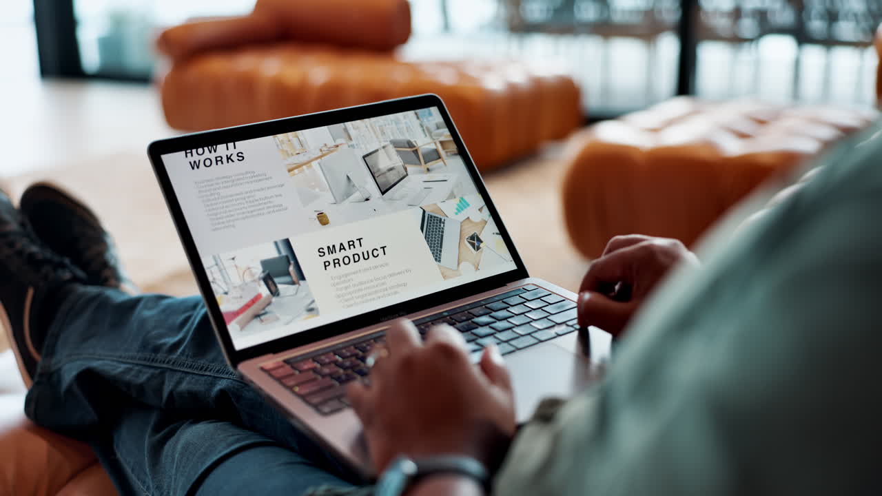 A person using a laptop with a business presentation on the screen