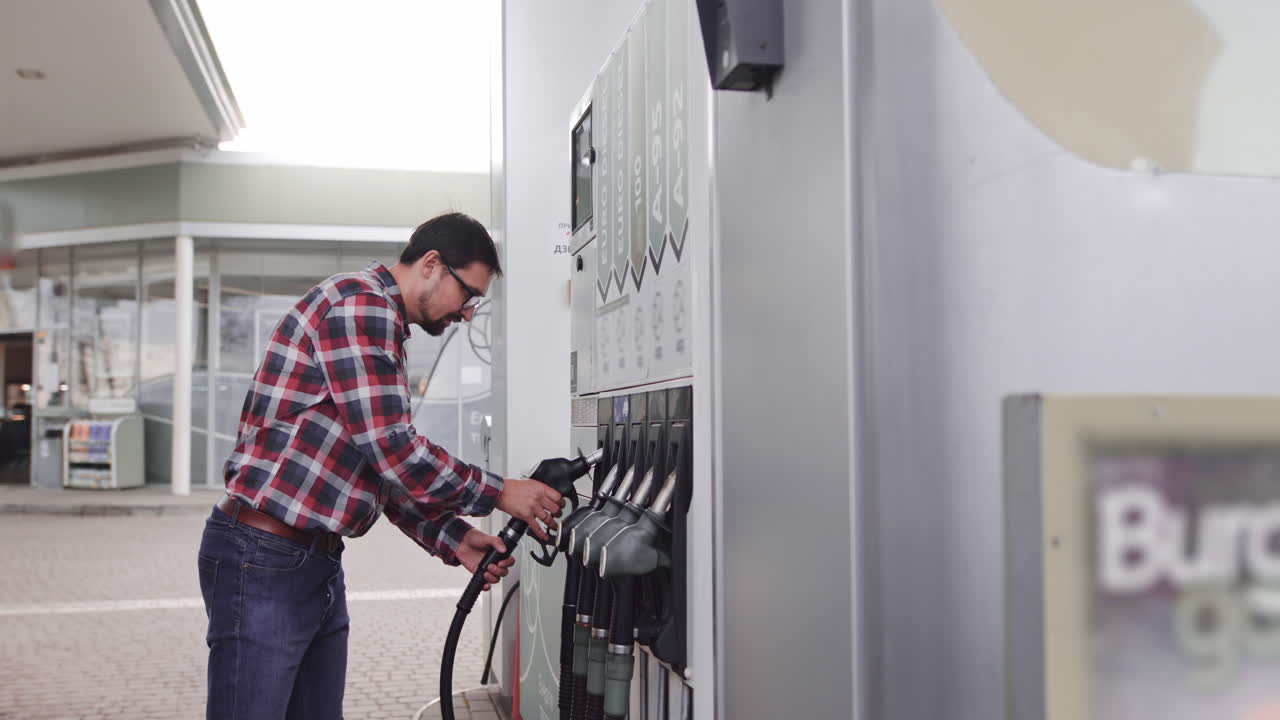 Man Filling Car at Gas Station