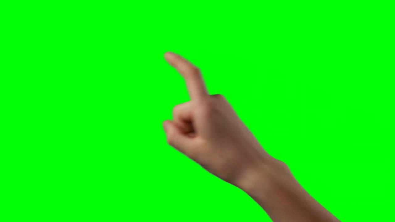 Person making hand gesture against green screen background