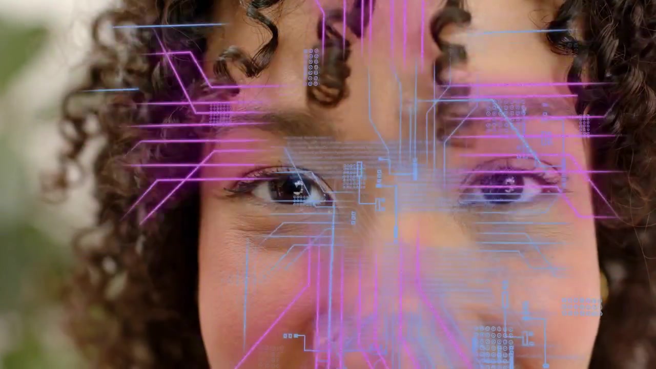 Woman holding gaze as blue circuit HUD emerging on face near nose ring, highlighting tech data