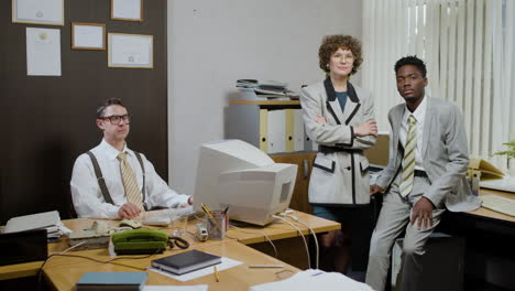 caucasian businessman using a retro computer in vintage office.