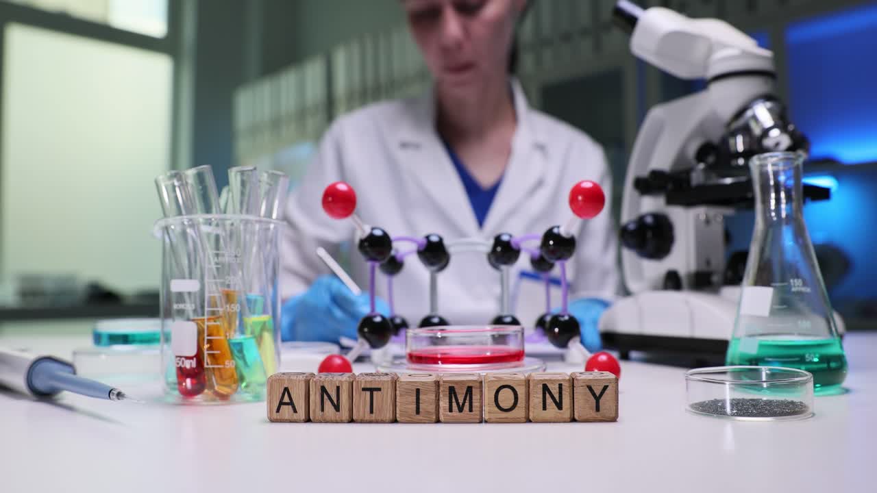 Scientist Working in a Chemistry Laboratory with Antimony Blocks