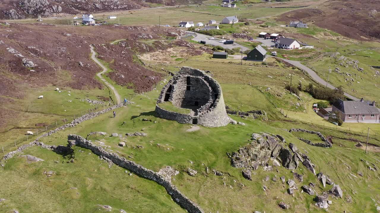 Drone shot circumnavigating the 'Dun Carloway Broch' on the west coast of the Isle of Lewis, part of the Outer Hebrides of Scotland