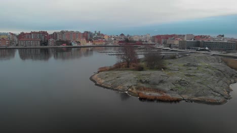 Aerial-view-over-Karlskrona,-Sweden-showing-parts-of-the-city-and-the-ocean-its-connected-to-4