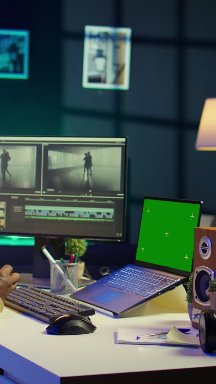 Vertical Video Videographer creating visual effects on montage next to green screen