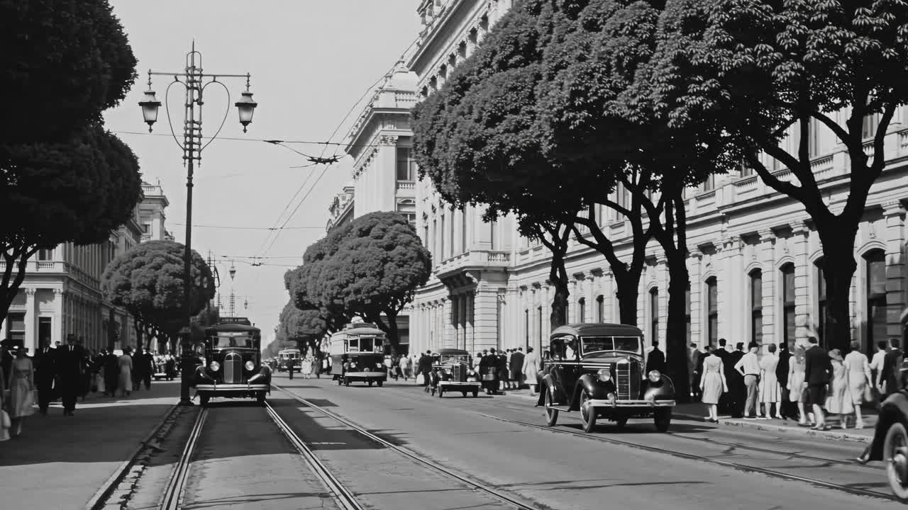 Black and white video of a bustling 1940s city street, captured from a low angle, showcasing vintage
