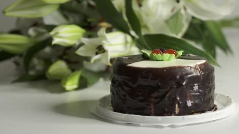 white lily bouquet and chocolate cake