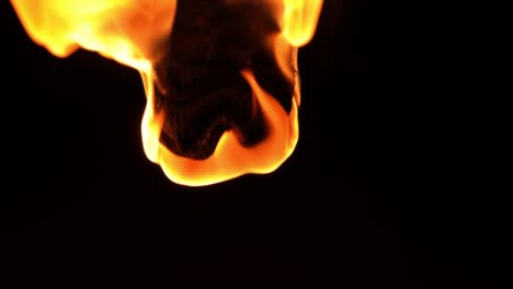 abstract background of a ball of flames falling through darkness