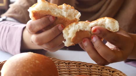 woman eating bread