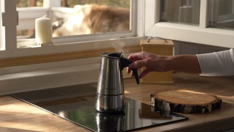 steams from a boiling kettle over an induction stove at the kitchen in arendel, zagorow poland near norwegian village