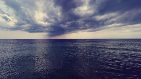 stormy sky and clouds over calm sea with