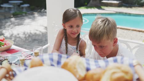 happy family eating together at table