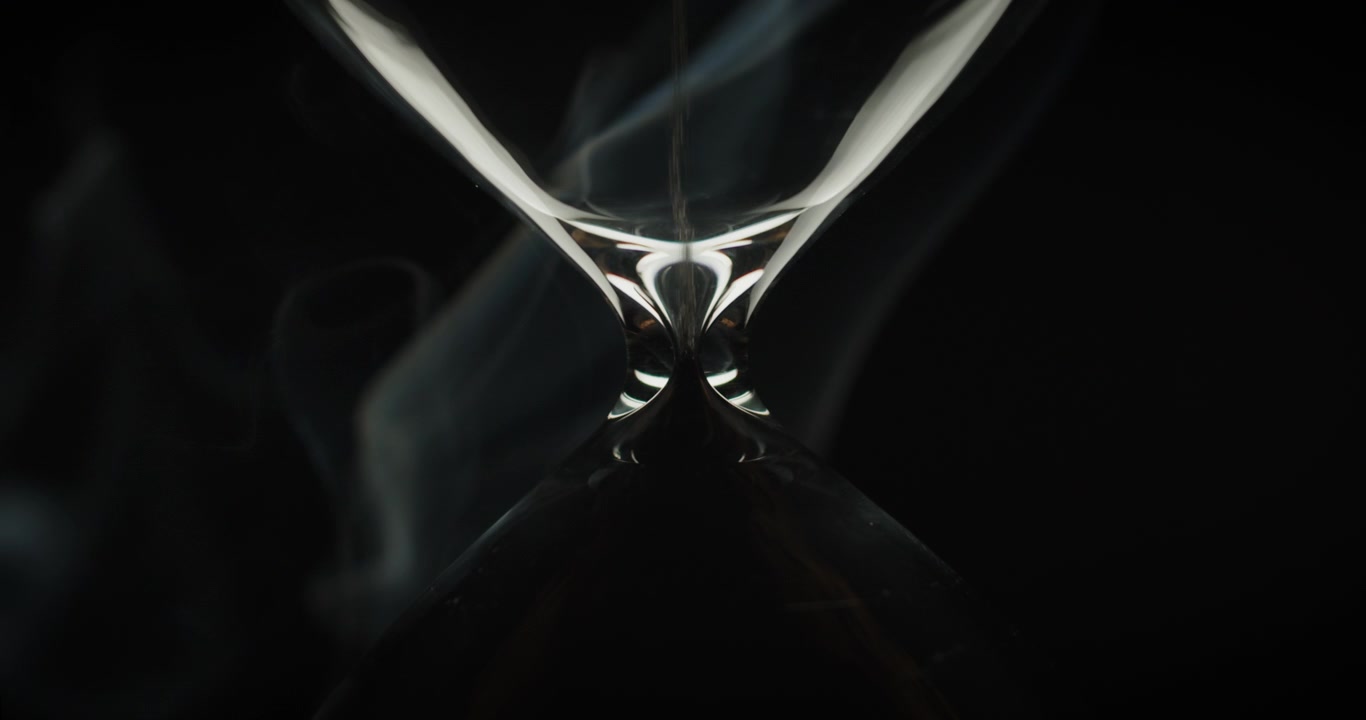 Sand moving in an upside down hourglass