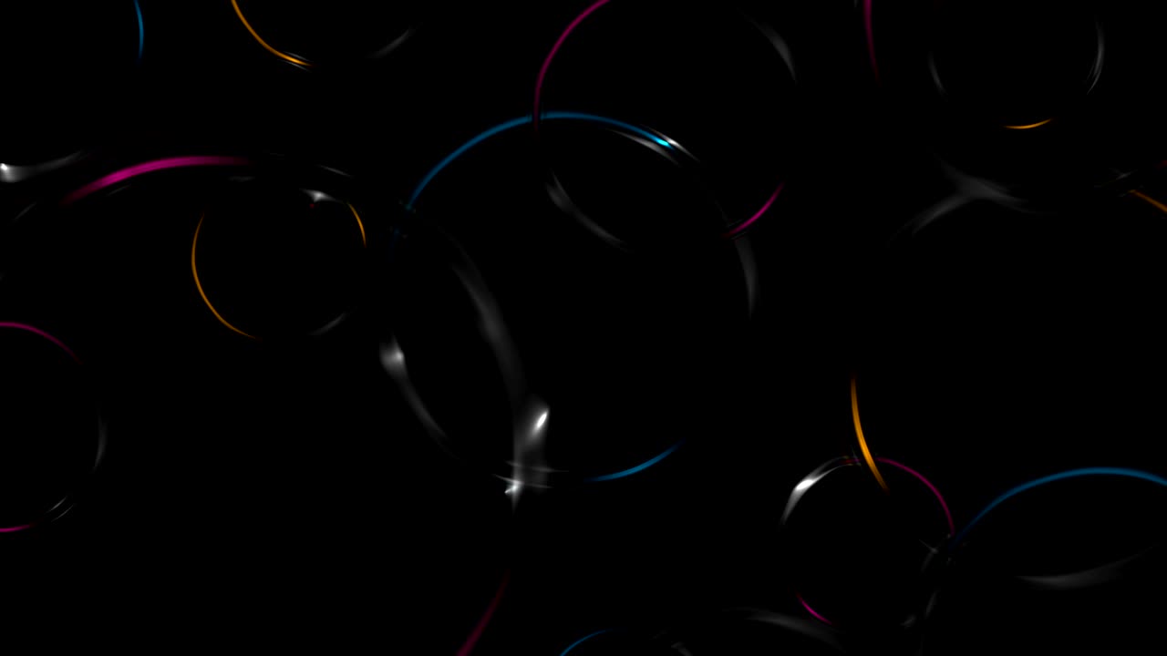 Colorful glossy glowing rings on black background
