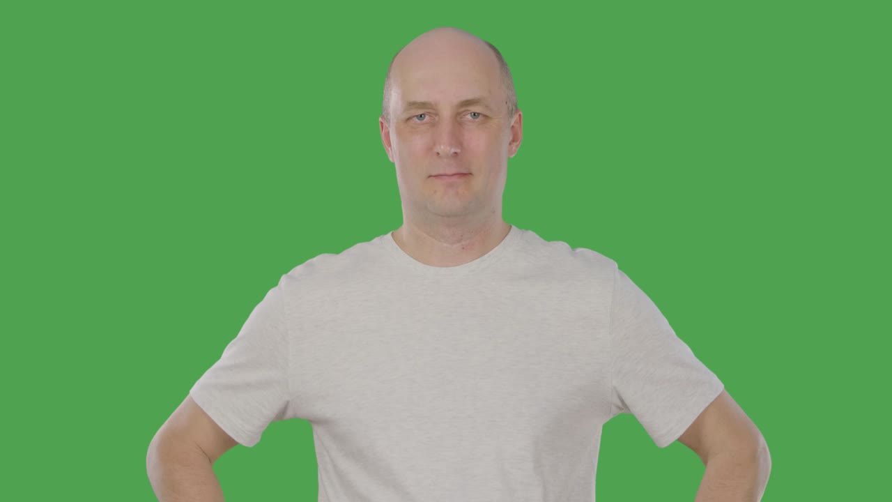 Smiling middle aged agree man nodding head. Alpha channel, keyed green screen