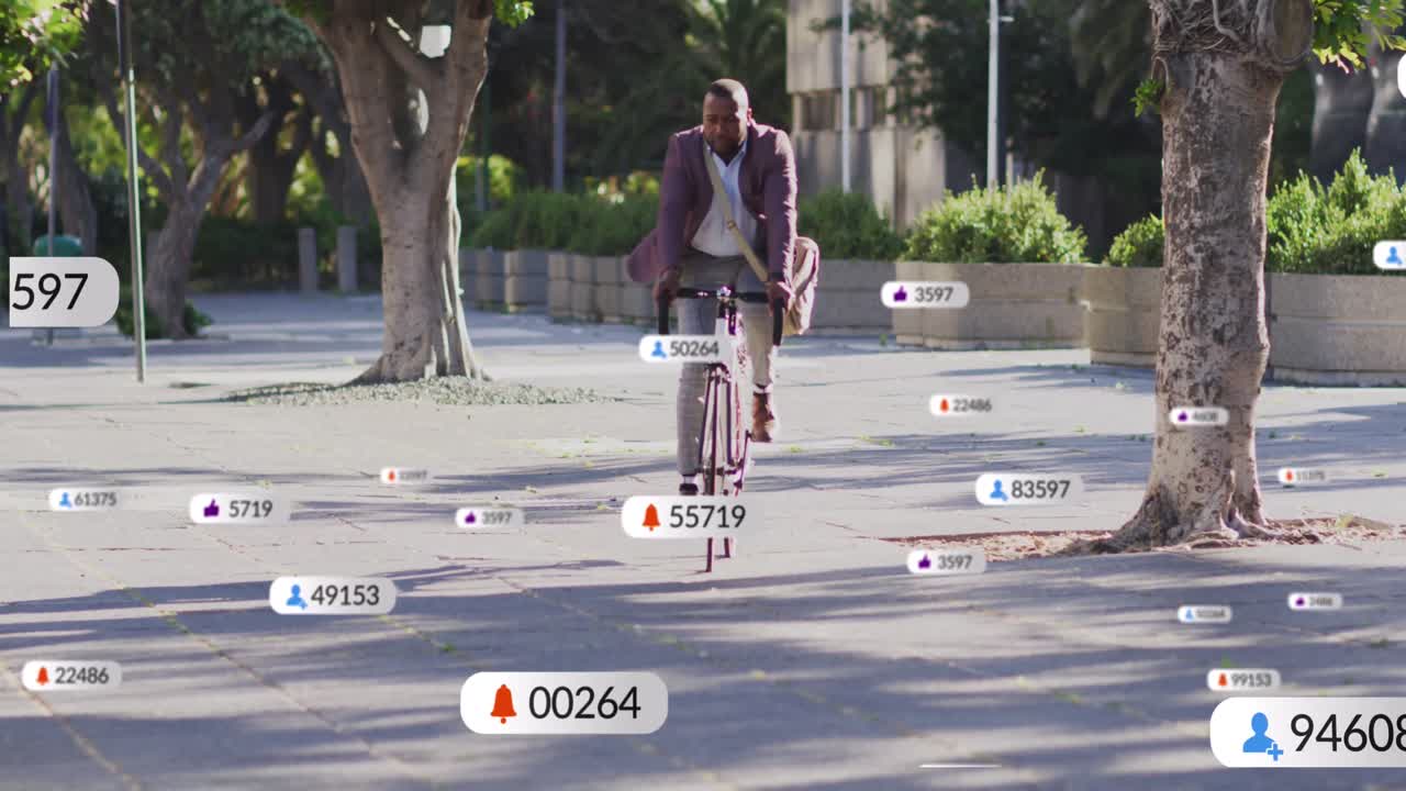 Animazione di icone di social media su un uomo afroamericano in bicicletta per strada