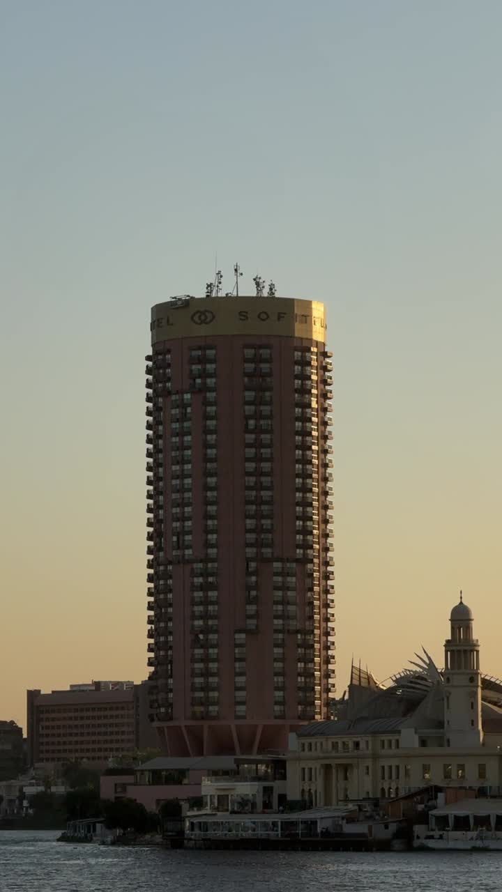 A view of buildings and bridge overlooking on Nile, close up shot, static shot