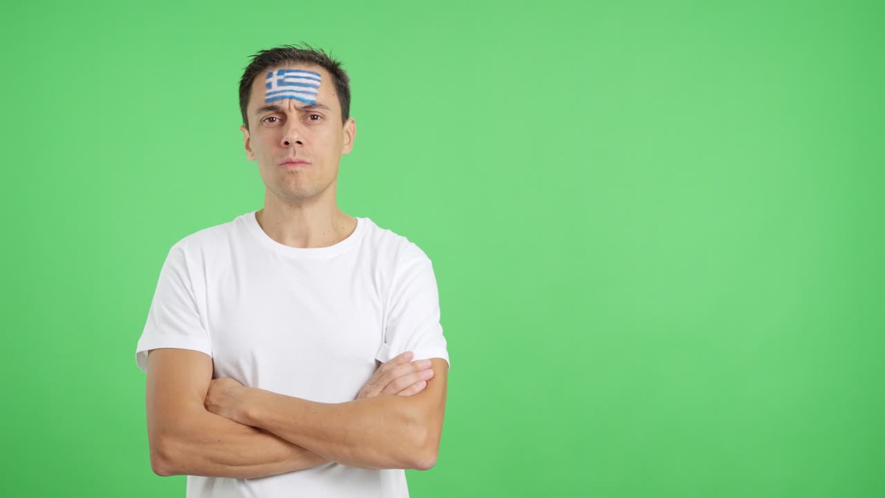 Dignified and serious man with greek flag painted on face