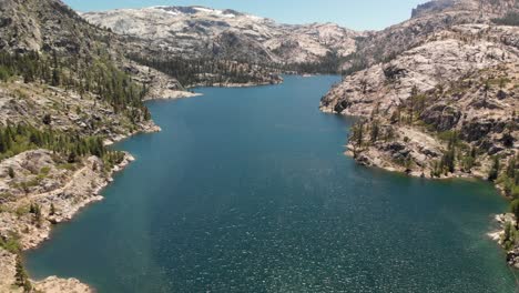 Expansive-aerial-view-of-a-dam-in-California's-Relief-Reservoir-near-Kennedy-Meadows