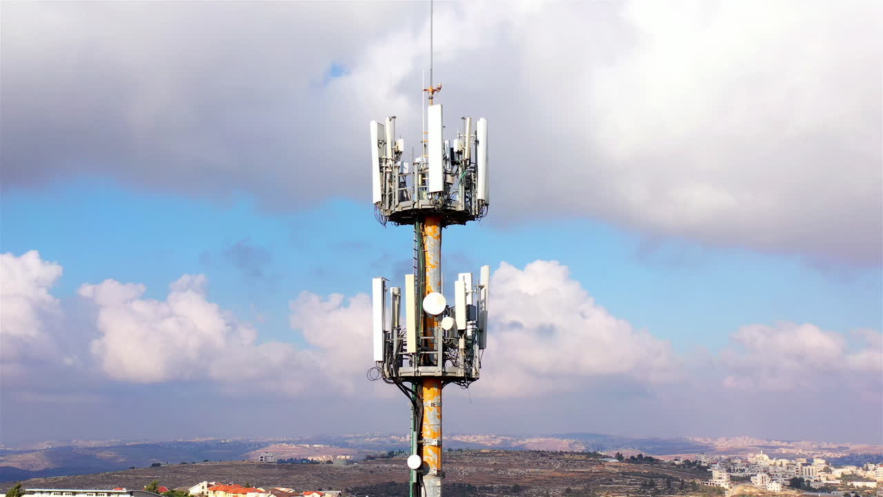 Aerial footage Close to cellular Antenna with blue sky and Clouds