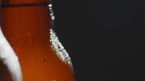 close up of condensation droplets on bottles of cold beer or soft drinks 2